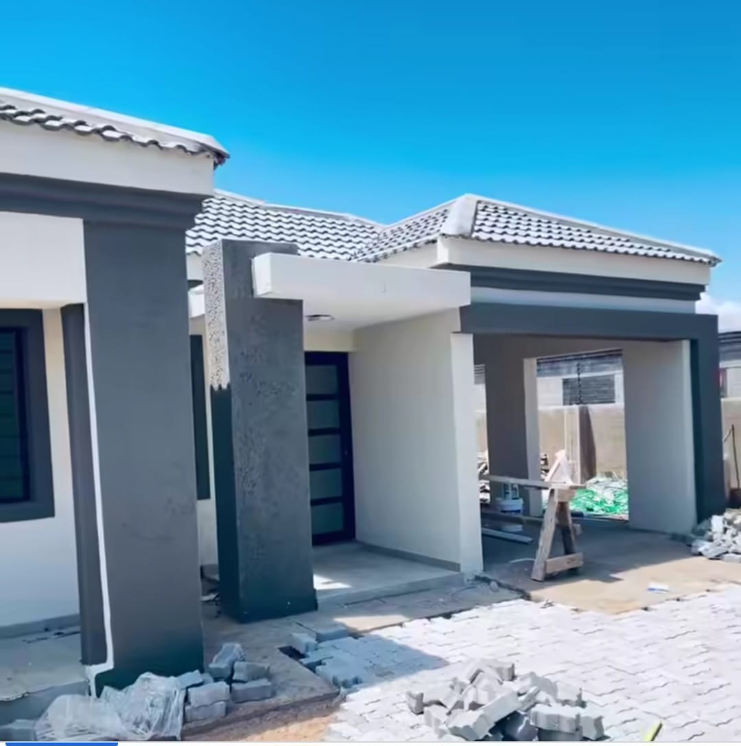 Modern home with charcoal pillars during paving